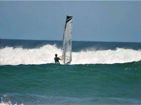 Getting some good waves and getting smashed on my SUP