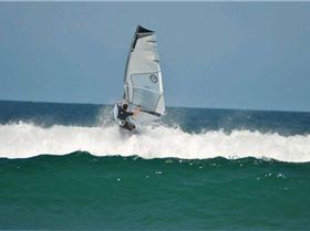 Getting some good waves and getting smashed on my SUP