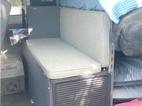 Bit washed out photo of the bench seat and fridge