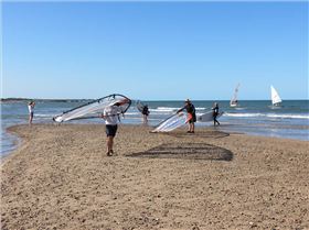 Some of the sailors coming in from a hard day on the water