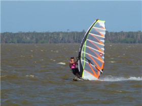 lOCAL sailor Kellie Tusler on an NXS speed slalom board with 5m Hotsail GPS  at lake cootharaba