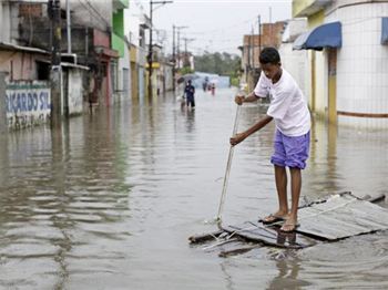 Stand up paddling provides a glimmer of light in Rio floods - Stand Up Paddle News