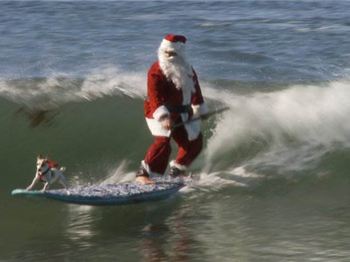 Santa goes over the falls on a stand  up paddle board - Stand Up Paddle News